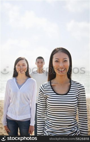 Portrait of Young Woman and Friends at the Beach
