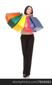 Portrait of young woman carrying shopping bags against white background