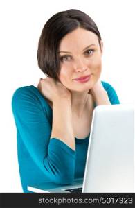 Portrait of young woman dreaming in front of laptop