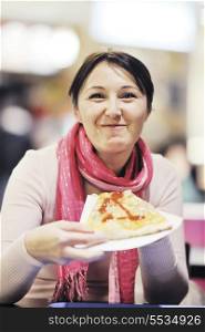 portrait of young woman eat pizza food at restaurant