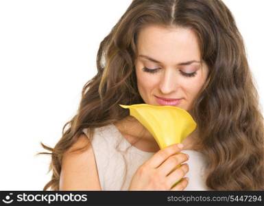 Portrait of young woman enjoying flower