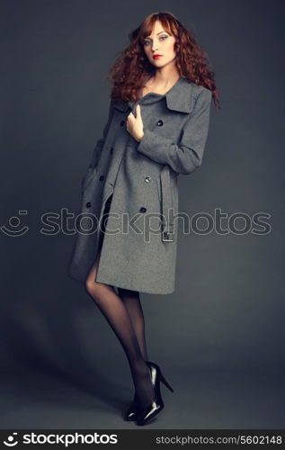 Portrait of young woman in autumn coat. Fashion photo