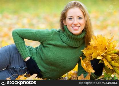 portrait of young woman in autumnal park