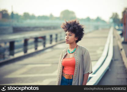 Portrait of young woman in city