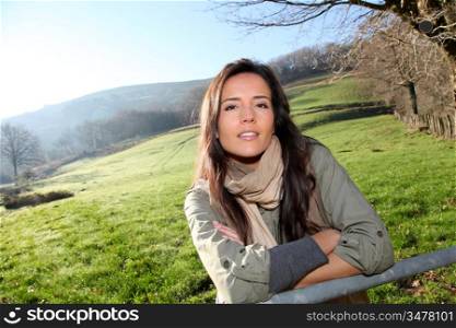 Portrait of young woman in country field