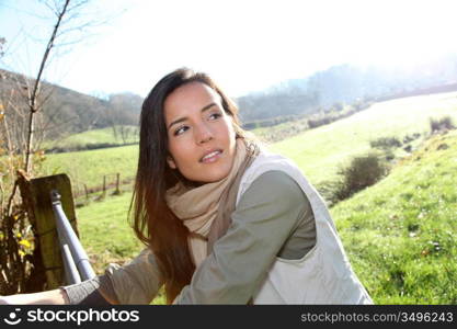 Portrait of young woman in country field