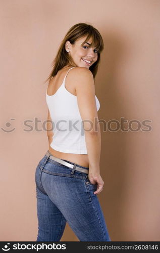 Portrait of young woman in jeans