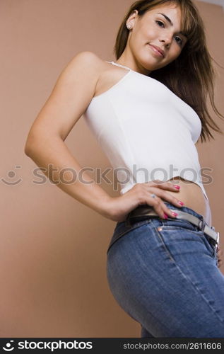 Portrait of young woman in jeans