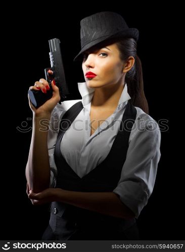 Portrait of young woman in manly style with gun isolated