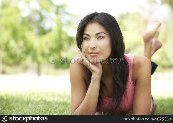 Portrait Of Young Woman In Park