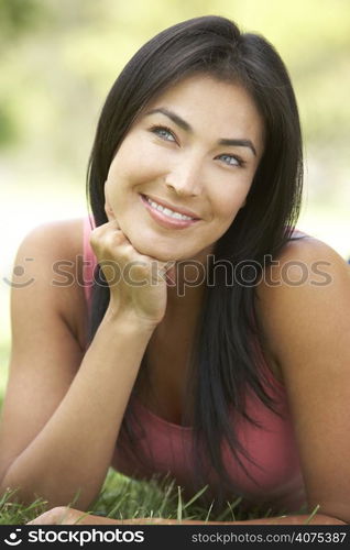 Portrait Of Young Woman In Park