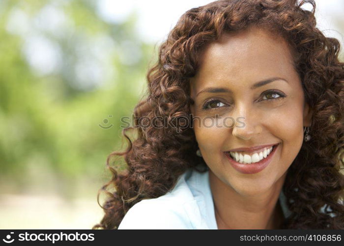 Portrait Of Young Woman In Park