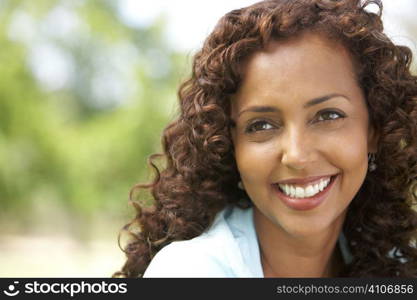 Portrait Of Young Woman In Park