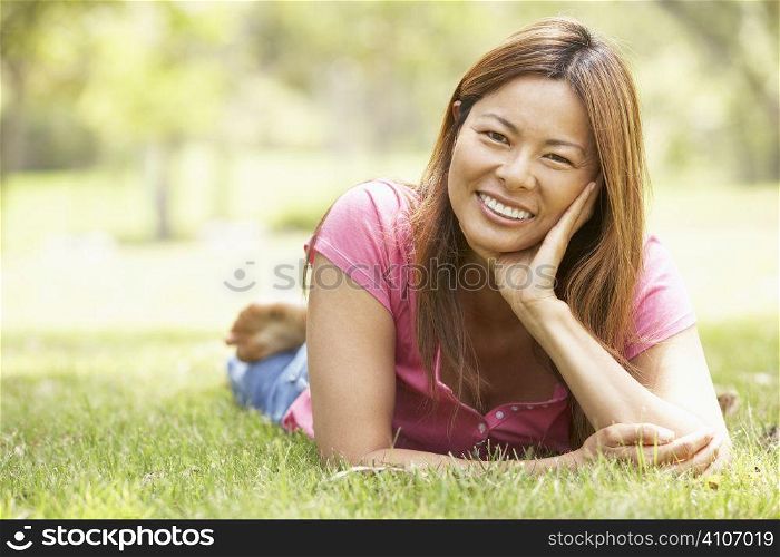 Portrait Of Young Woman In Park