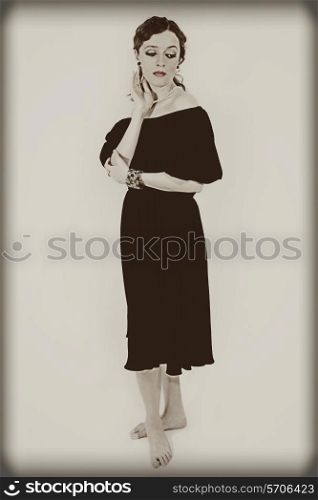 Portrait of young woman in retro style on white background