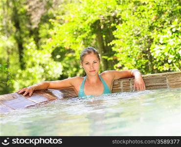 Portrait of young woman in swimming pool