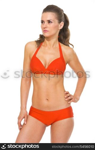 Portrait of young woman in swimsuit looking on copy space