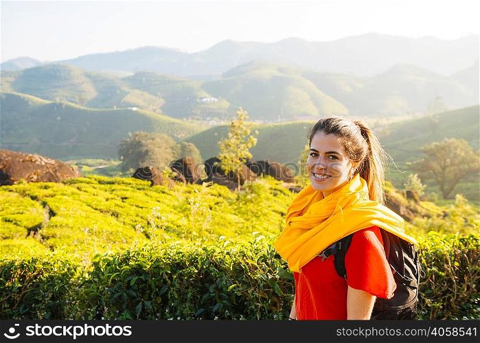 Portrait of young woman in tea plantations near Munnar, Kerala, India