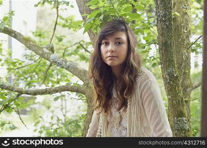 Portrait of young woman in woods