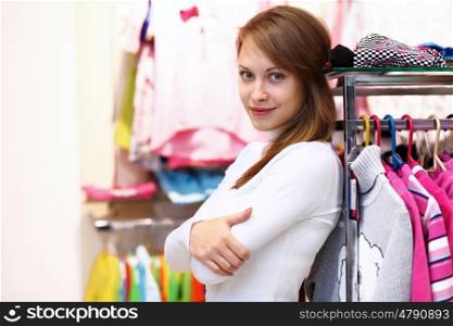Portrait of young woman inside a store buying clothes