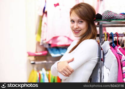 Portrait of young woman inside a store buying clothes