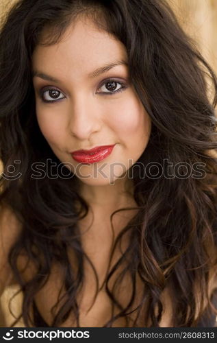 Portrait of young woman looking at camera