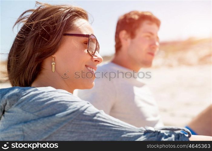 Portrait of young woman on beach. Portrait of young woman on beach with his friends on background