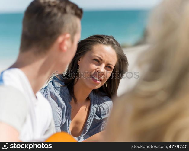 Portrait of young woman on beach. Portrait of young woman on beach with his friends on background