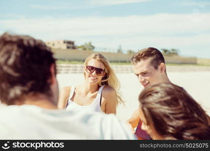 Portrait of young woman on beach. Portrait of young woman on beach with his friends on background