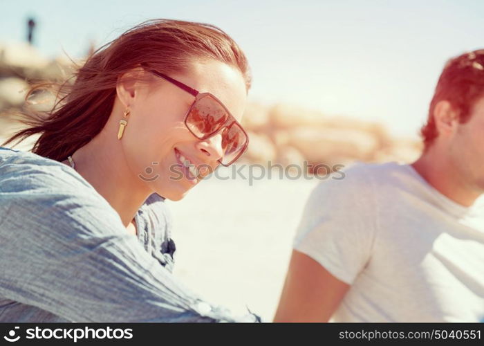 Portrait of young woman on beach. Portrait of young woman on beach with his friends on background