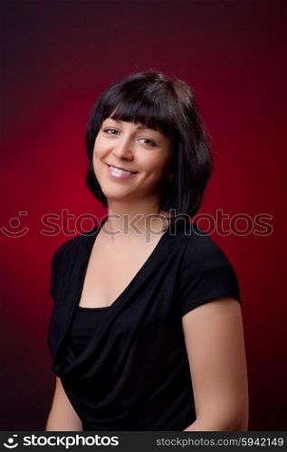 Portrait of young woman on red background