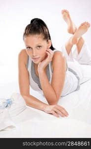 Portrait of young woman relaxing after exercises on white background