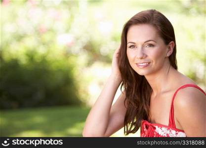 Portrait Of Young Woman Relaxing In Park