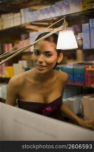 Portrait of young woman shopping in beauty supply store