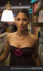 Portrait of young woman shopping in beauty supply store