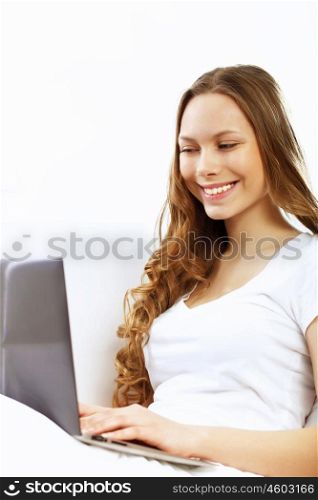 Portrait of young woman sitting with a notebook