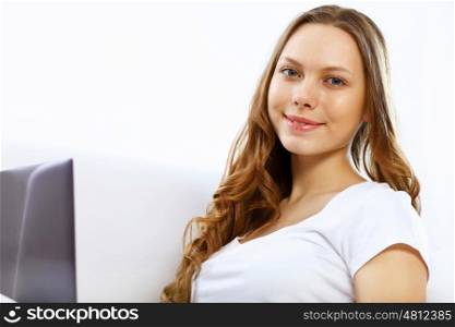 Portrait of young woman sitting with a notebook