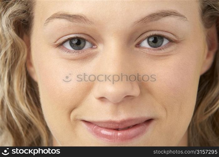 Portrait Of Young Woman Smiling At The Camera