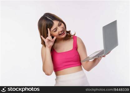 Portrait of young woman taking a photo with laptop computer isolated over white background. Business, people and technology concept.