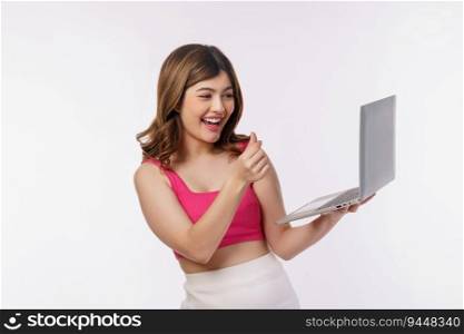 Portrait of young woman taking a photo with laptop computer isolated over white background. Business, people and technology concept.
