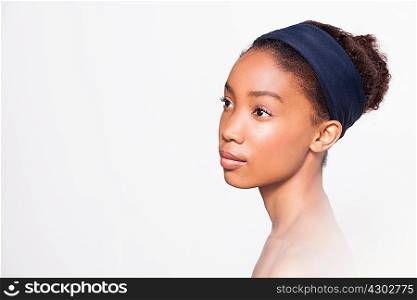 Portrait of young woman wearing headband