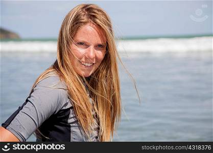 Portrait of young woman wearing wetsuit