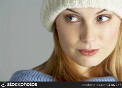 Portrait Of Young Woman Wearing Winter Clothes
