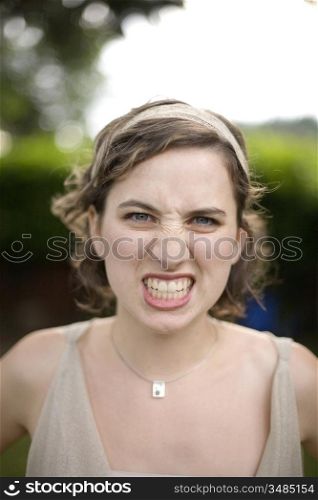 Portrait of Young Woman with Angry Look