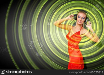 Portrait of young woman with headphones and glittering background