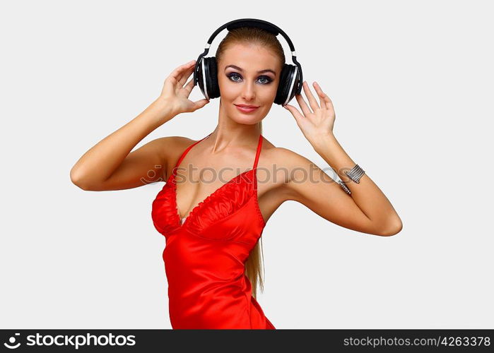 Portrait of young woman with headphones in studio