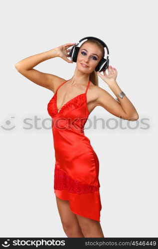 Portrait of young woman with headphones in studio