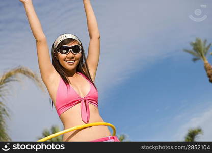 Portrait of Young Woman with Hula Hoop, Smiling
