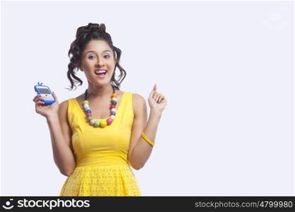 Portrait of young woman with mobile phone