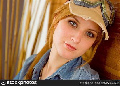 Portrait of young woman with pilot goggles